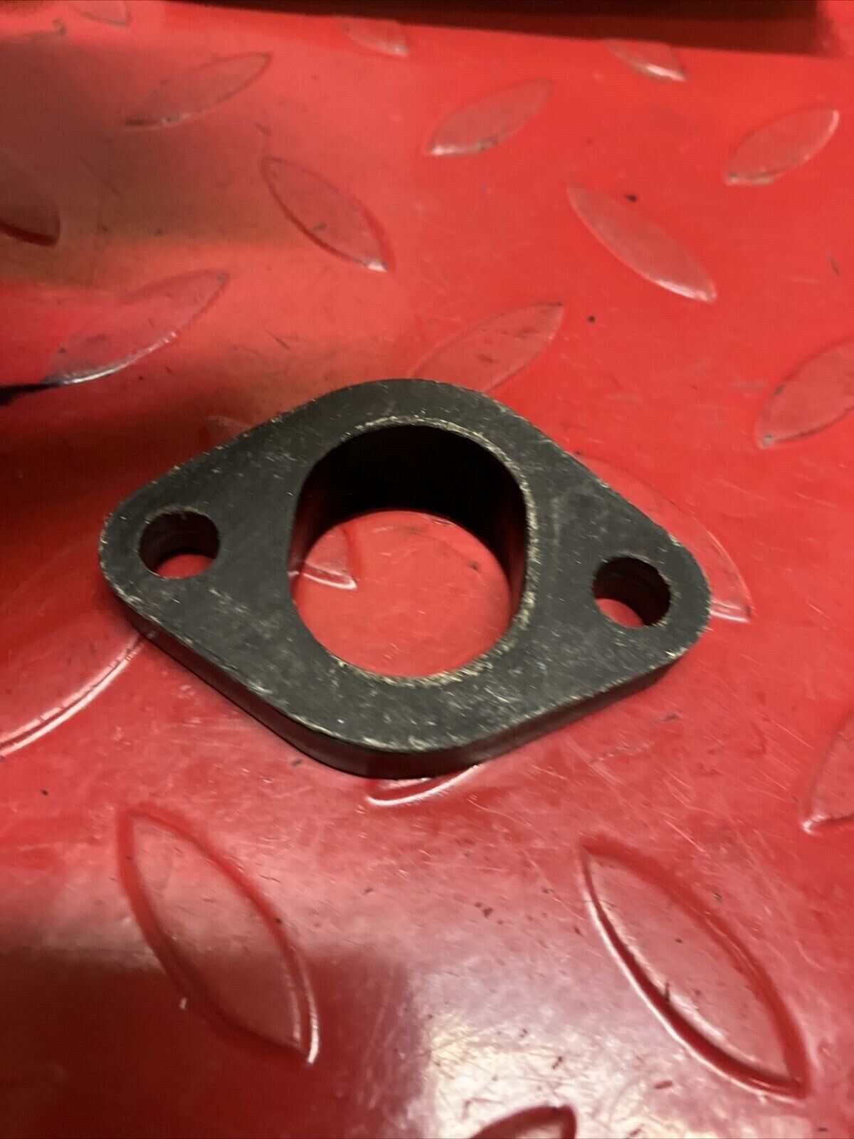 Suzuki TC125 1972 intake manifold carburetor insulator joint