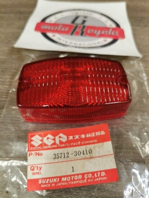 NEW NOS SUZUKI DR100 DR125 DR250 DR400 DR185 DS80 PE250 LENS 35712-30410 S49