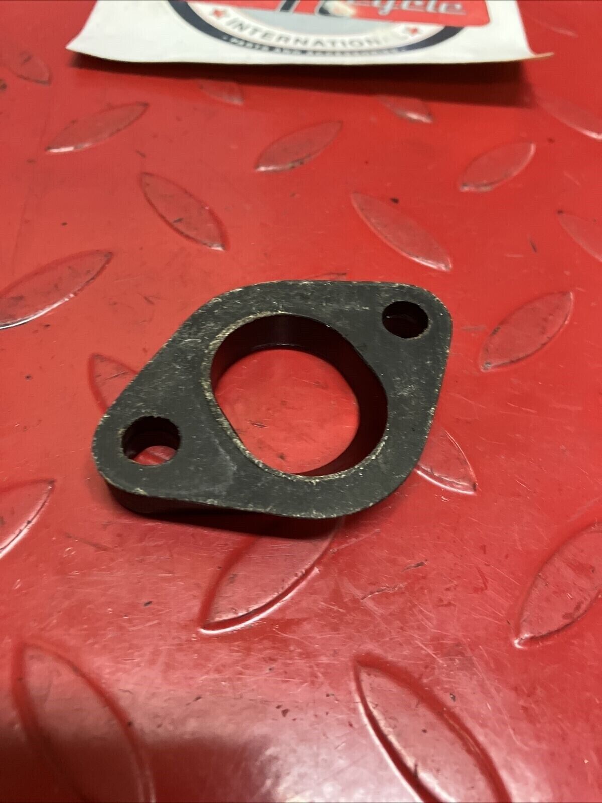 Suzuki TC125 1972 intake manifold carburetor insulator joint