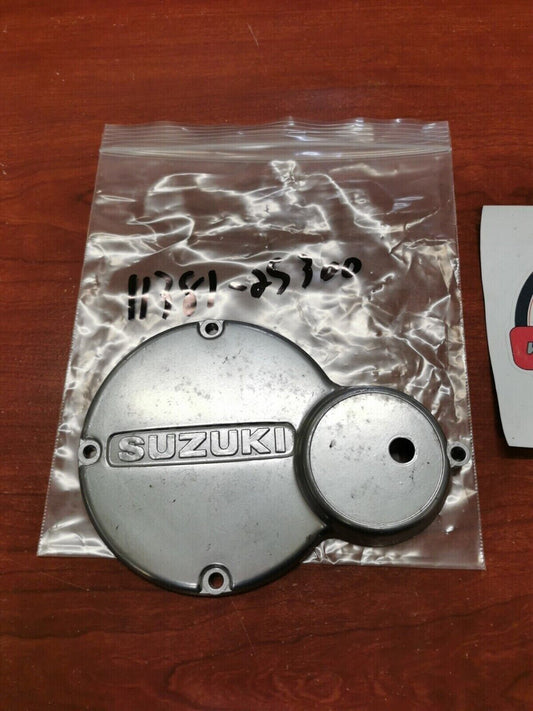 NOS SUZUKI 1973 - 1975 TS100 MAGNETO INSPECTION COVER CAP 11381-25300 S30