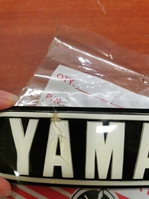 NOS Yamaha 1974 RD200 FUEL TANK EMBLEM (DAMAGED) 337-24161-10-00 Y121