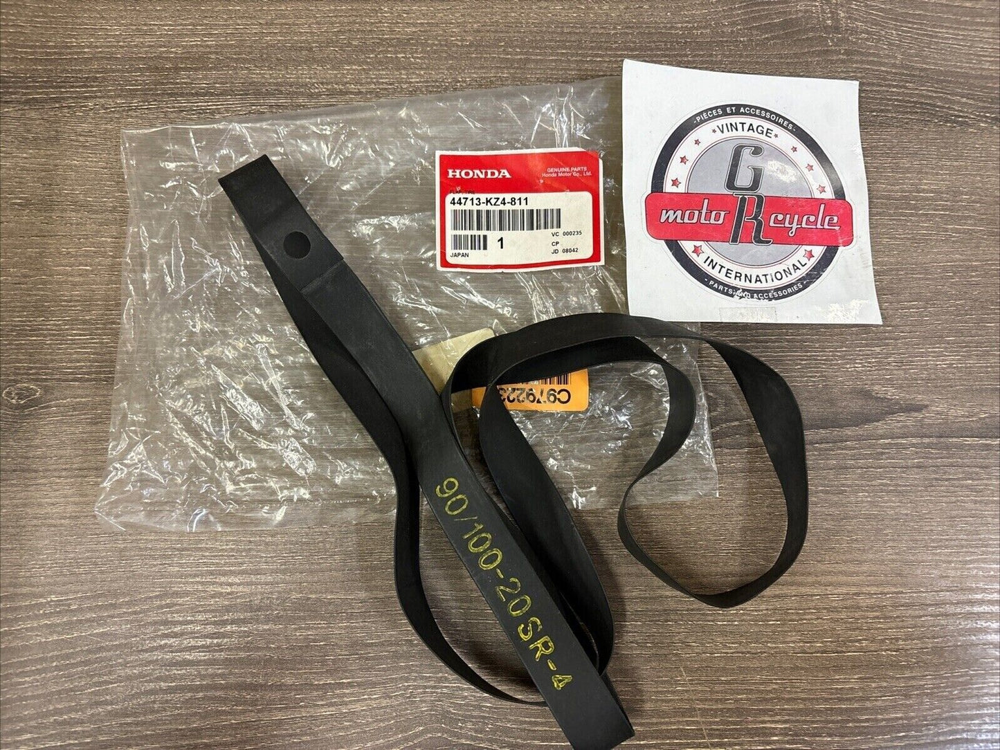 NOS Honda CR125R CR250R CRF250R CRF450R TIRE FLAP (DUNLOP) 44713-KZ4-811 H122