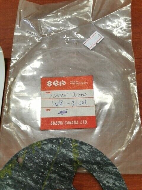 NOS Suzuki CLUTCH RELEASE ADJUSTER CAP GASKET 11495-31000 SUB. 11495-31001 S32