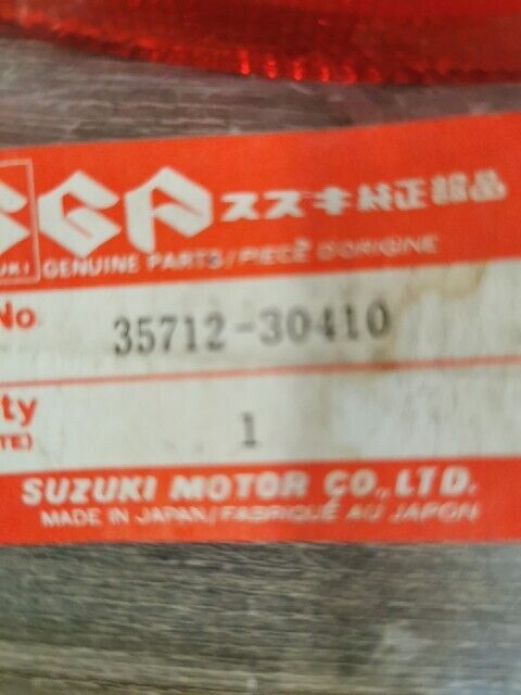 NEW NOS SUZUKI DR100 DR125 DR250 DR400 DR185 DS80 PE250 LENS 35712-30410 S49