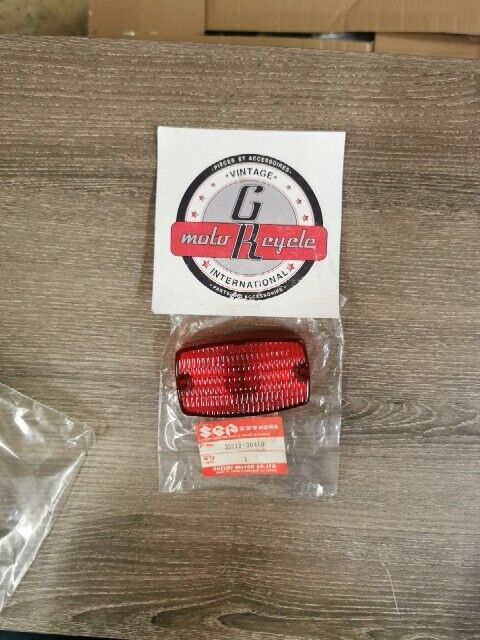 NEW NOS SUZUKI DR100 DR125 DR250 DR400 DR185 DS80 PE250 LENS 35712-30410 S49