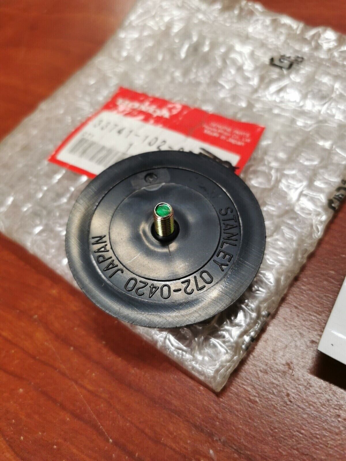 NOS Honda CMX250C CMX250X NH80 NQ50 FRONT REFLEX REFLECTOR 33741-102-870 H64