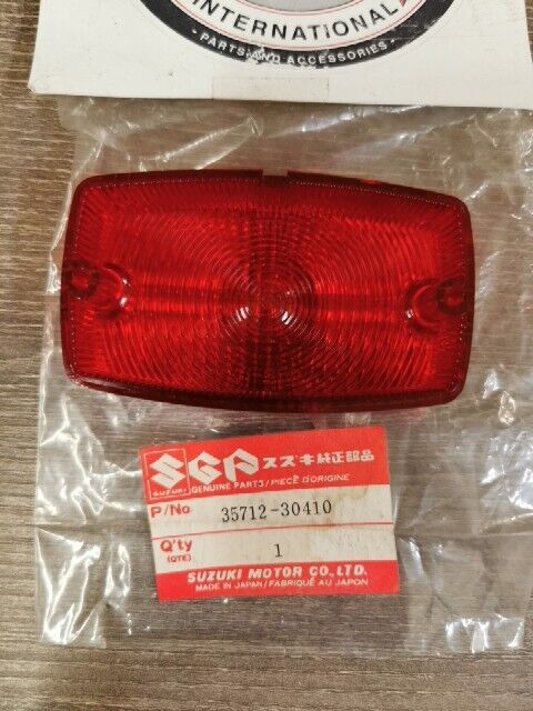 NEW NOS SUZUKI DR100 DR125 DR250 DR400 DR185 DS80 PE250 LENS 35712-30410 S49