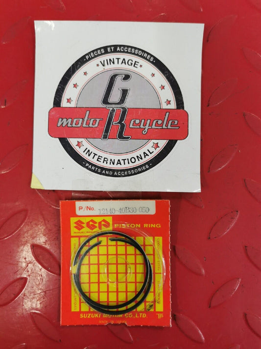 NOS SUZUKI LT80 2002 2003 2004 2005 2006 RING SET OS 0.5 12140-40B30-050 S11