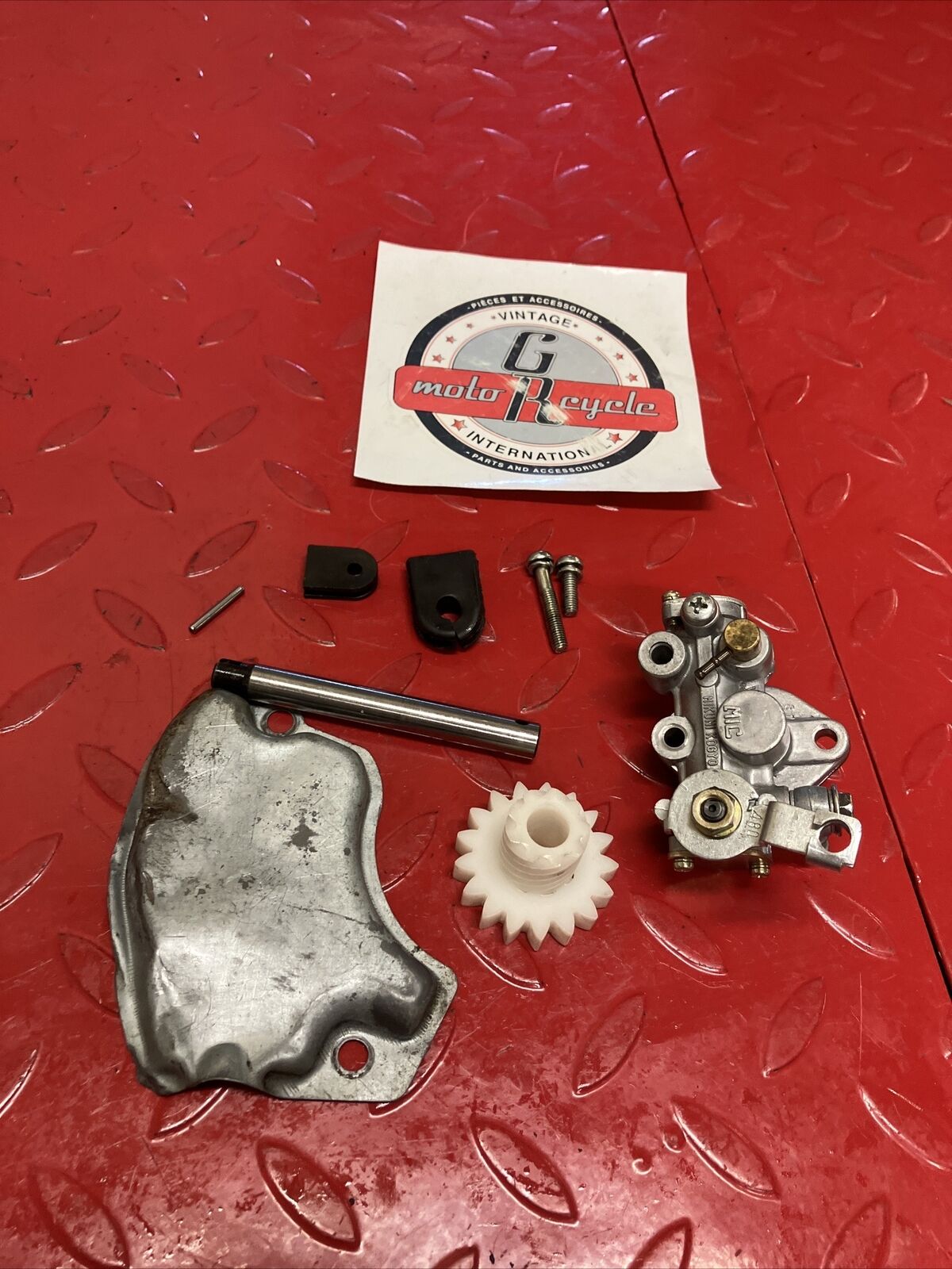 Suzuki DS100 1978 oil pump assembly gear cover shaft