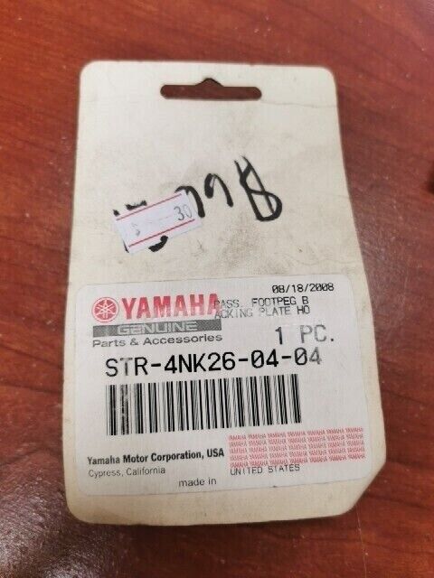 NOS Yamaha PASSENGER FOOTPEG BACKING PLATE HOLE PLUG STR-4NK26-04-04 Y102