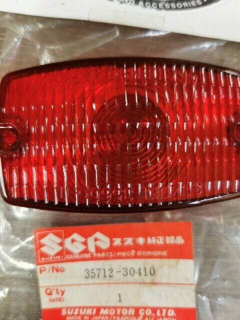 NEW NOS SUZUKI DR100 DR125 DR250 DR400 DR185 DS80 PE250 LENS 35712-30410 S49
