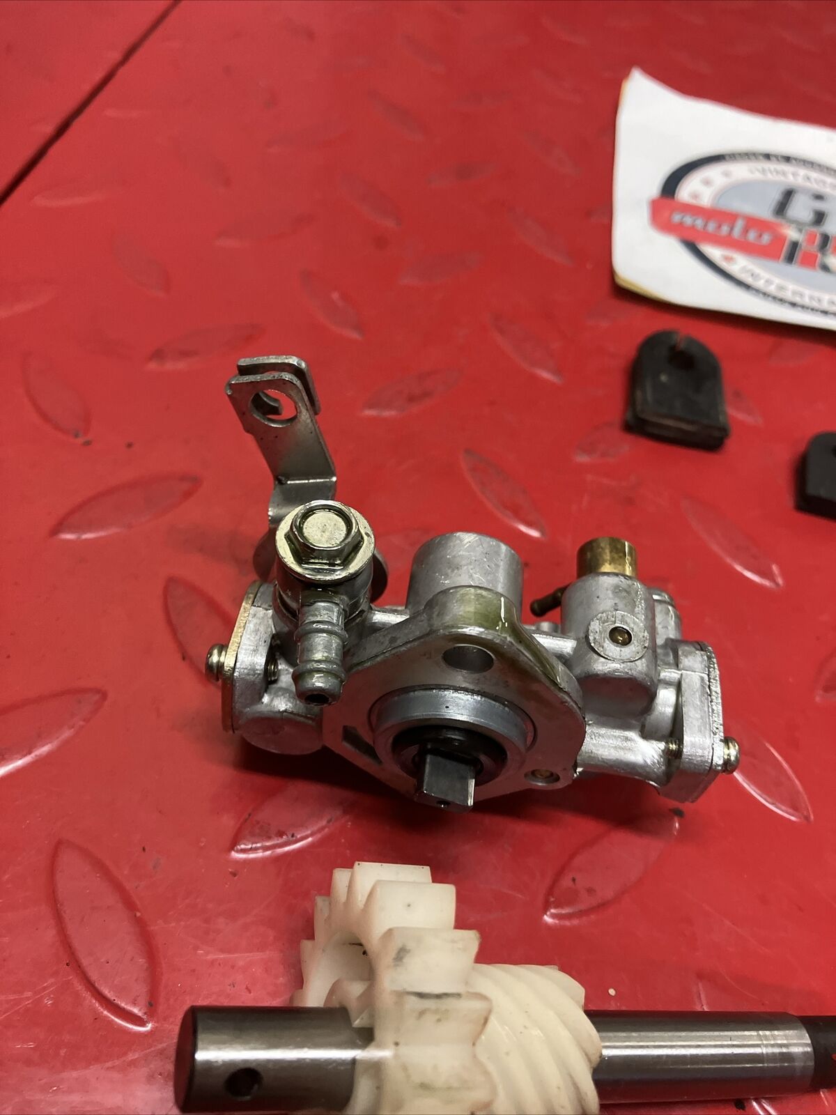 Suzuki DS100 1980 oil pump assembly gear cover shaft