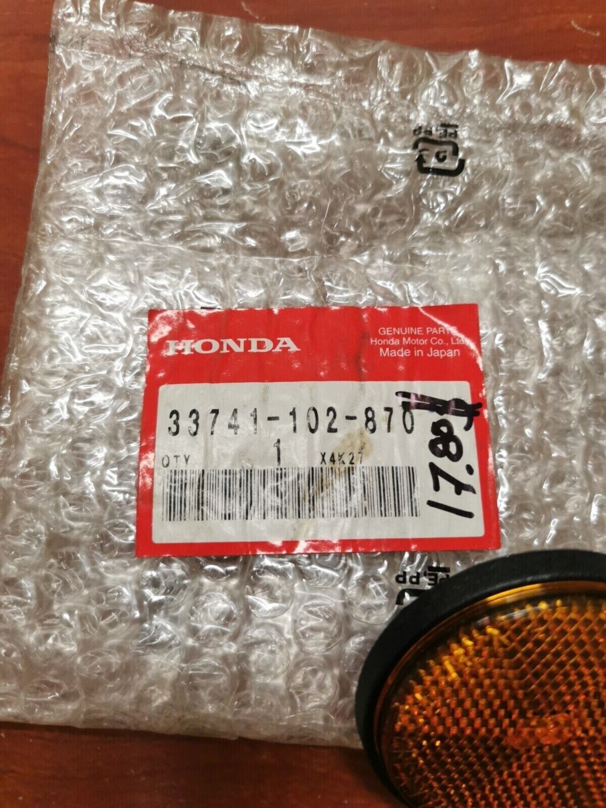 NOS Honda CMX250C CMX250X NH80 NQ50 FRONT REFLEX REFLECTOR 33741-102-870 H64