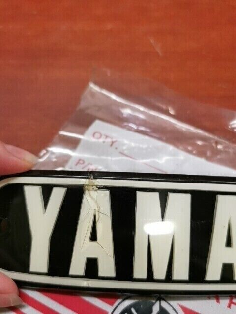 NOS Yamaha 1974 RD200 FUEL TANK EMBLEM (DAMAGED) 337-24161-10-00 Y121