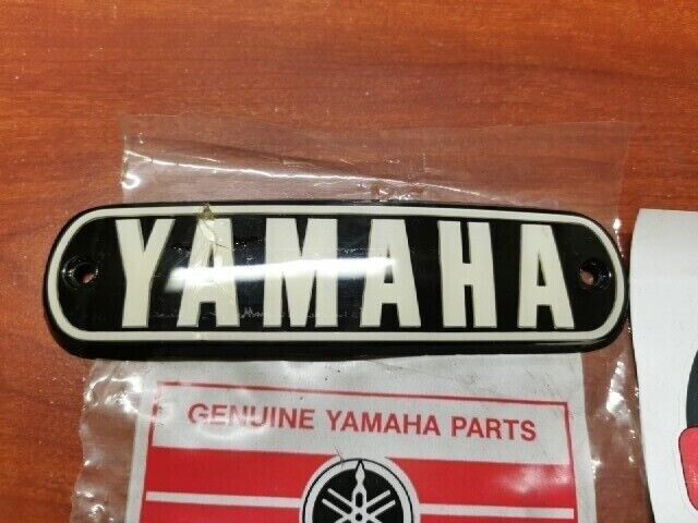 NOS Yamaha 1974 RD200 FUEL TANK EMBLEM (DAMAGED) 337-24161-10-00 Y121
