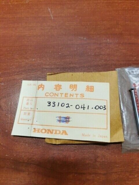 NOS Honda C50 C65 C70 C90 CD175 CL70 CT70 HEADLIGHT SCREW 33102-041-003 H90