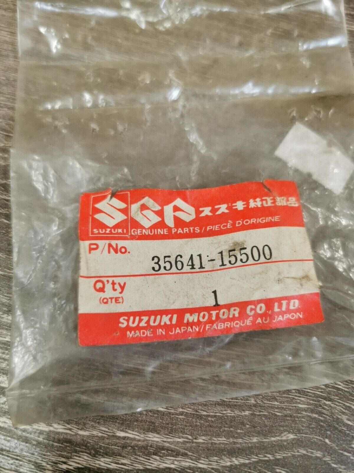 NOS SUZUKI GR650 1983 BRACKET REAR LH 35641-15500 S23