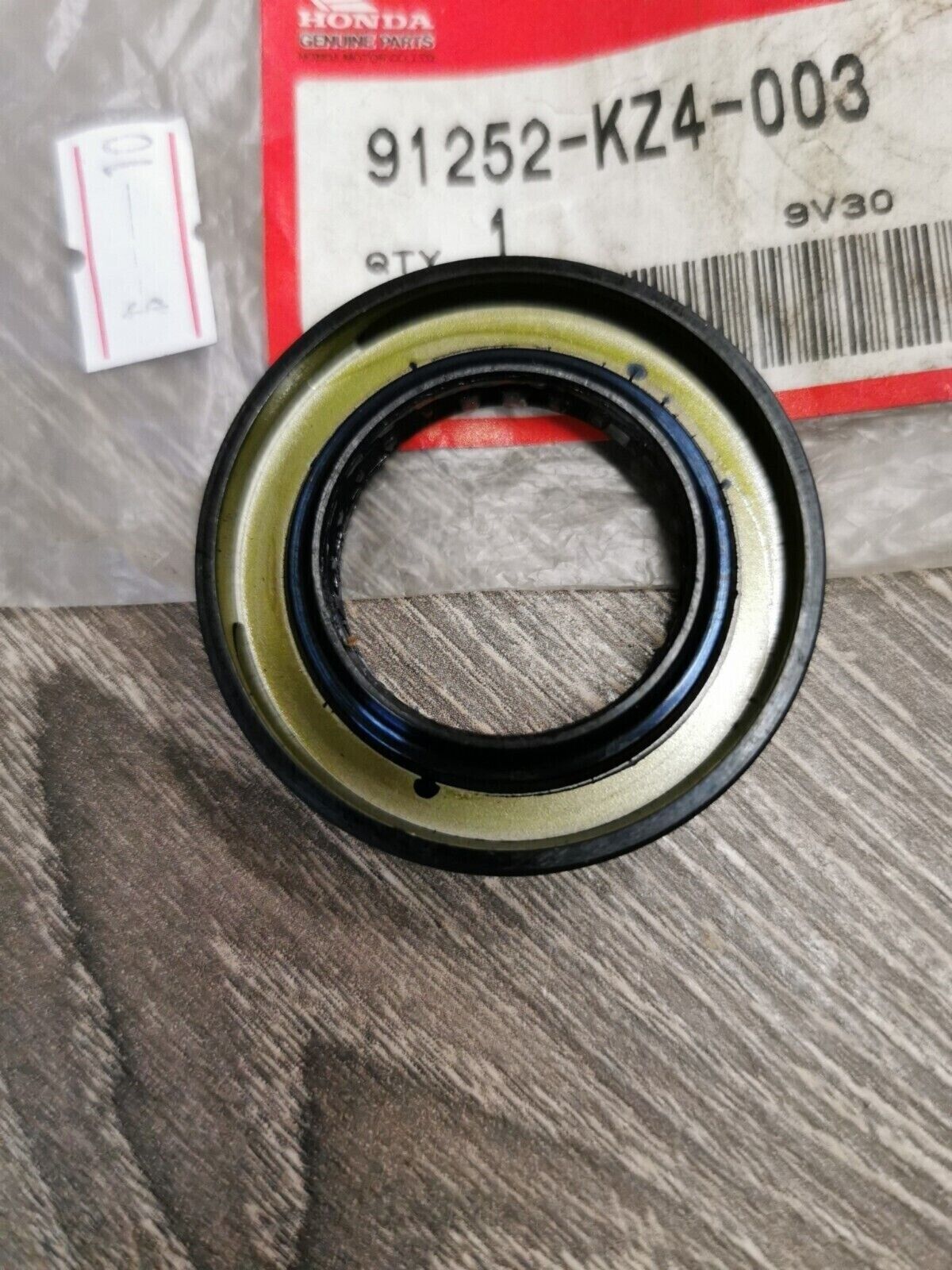 NEW NOS HONDA DUST SEAL 28X47X7 91252-KZ4-003 H54