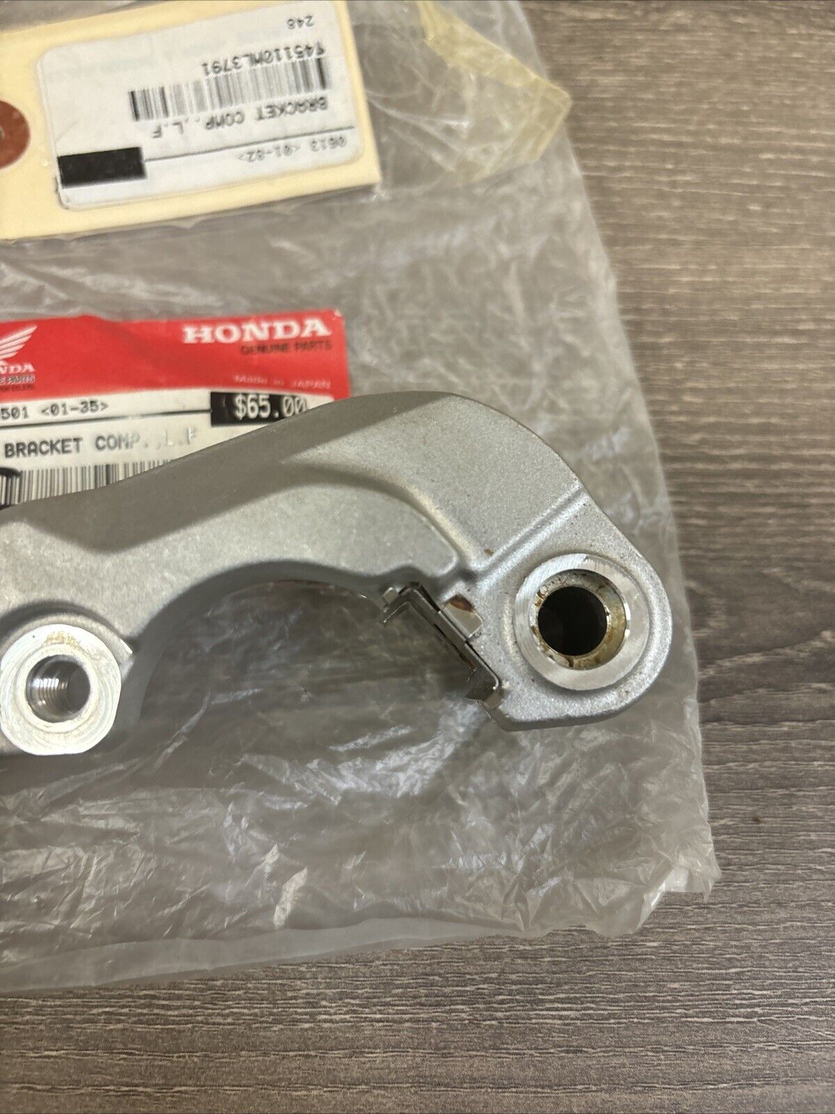 NOS Honda CR125R CR250R CR500R LEFT FRONT BRACKET 45110-KZ3-026 H120