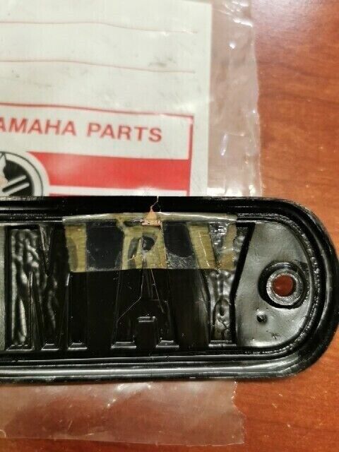 NOS Yamaha 1974 RD200 FUEL TANK EMBLEM (DAMAGED) 337-24161-10-00 Y121
