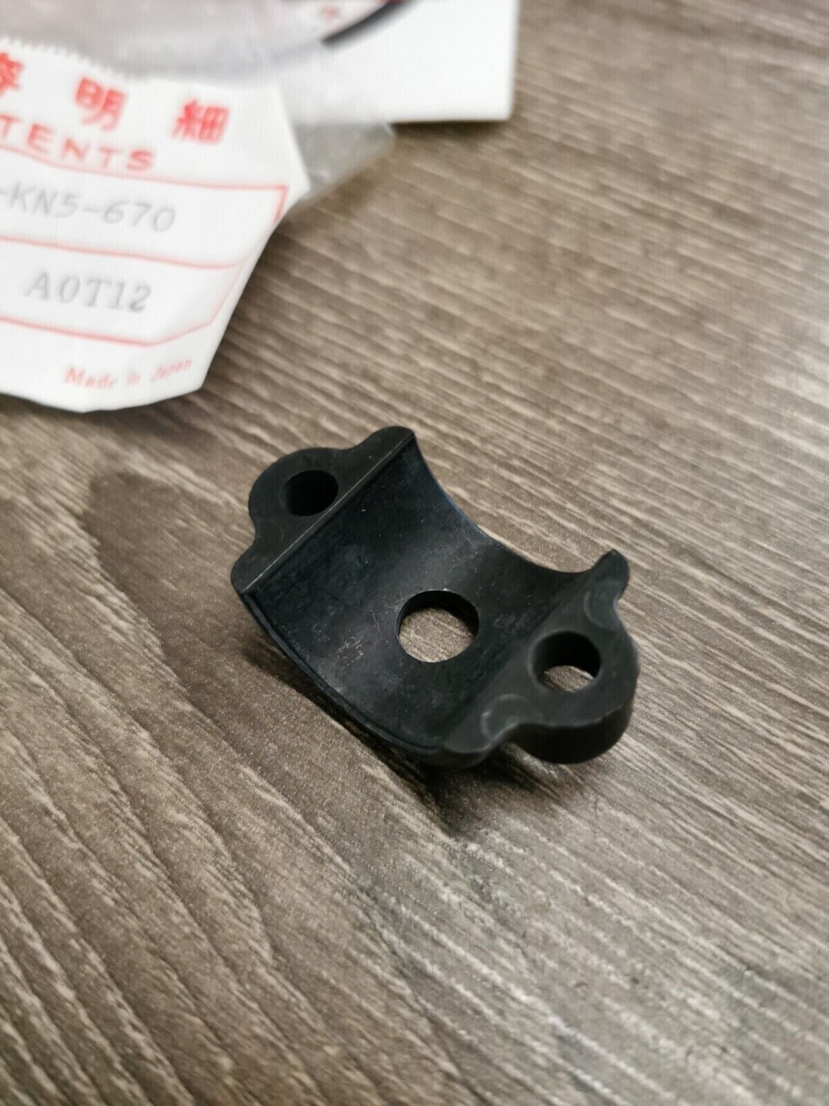 NOS HONDA HOLDER LEVER BRACKET 53173-KN5-670 H50
