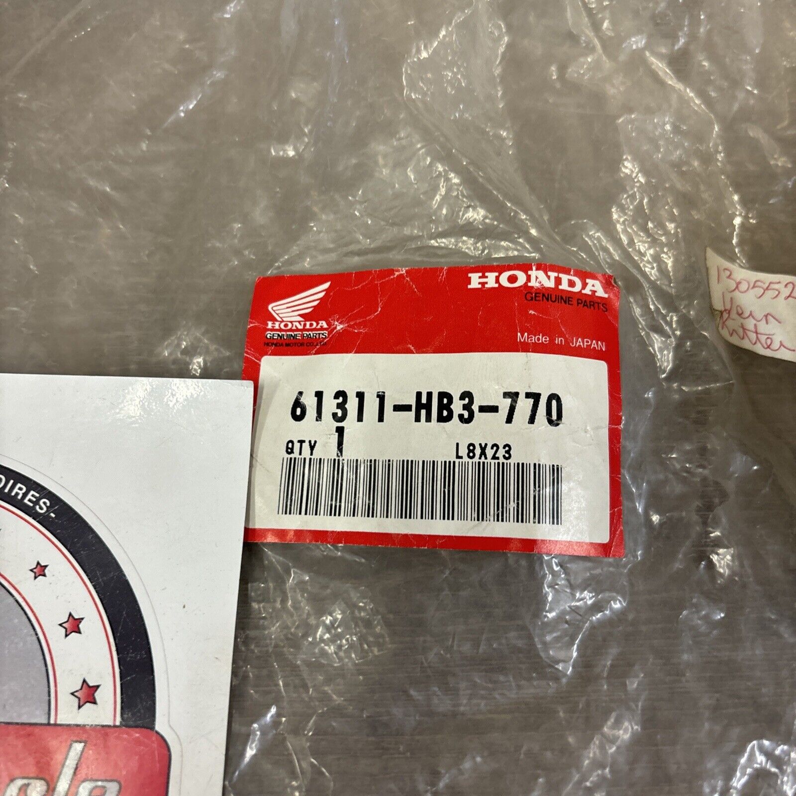 NOS Honda 1986 - 1987 TRX200SX HEADLIGHT BRACKET 61311-HB3-770 H114