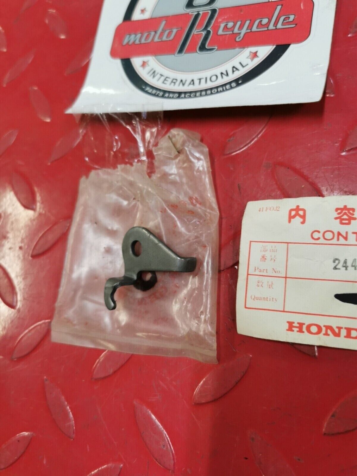 NOS Honda 1976 CB750K PLATE, GEARSHIFT FORK SHAFT STOPPER 24436-300-010 H32