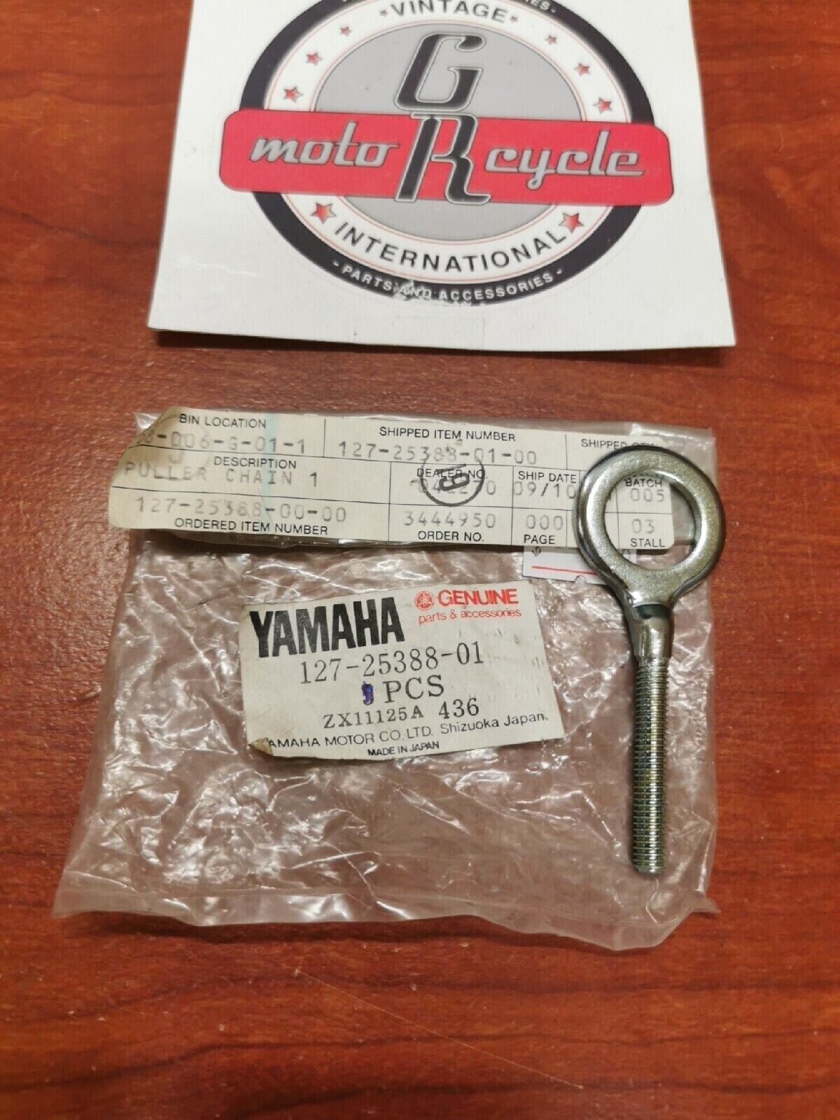 NOS Yamaha REAR WHEEL CHAIN PULLER 1 127-25388-01-00 Y69