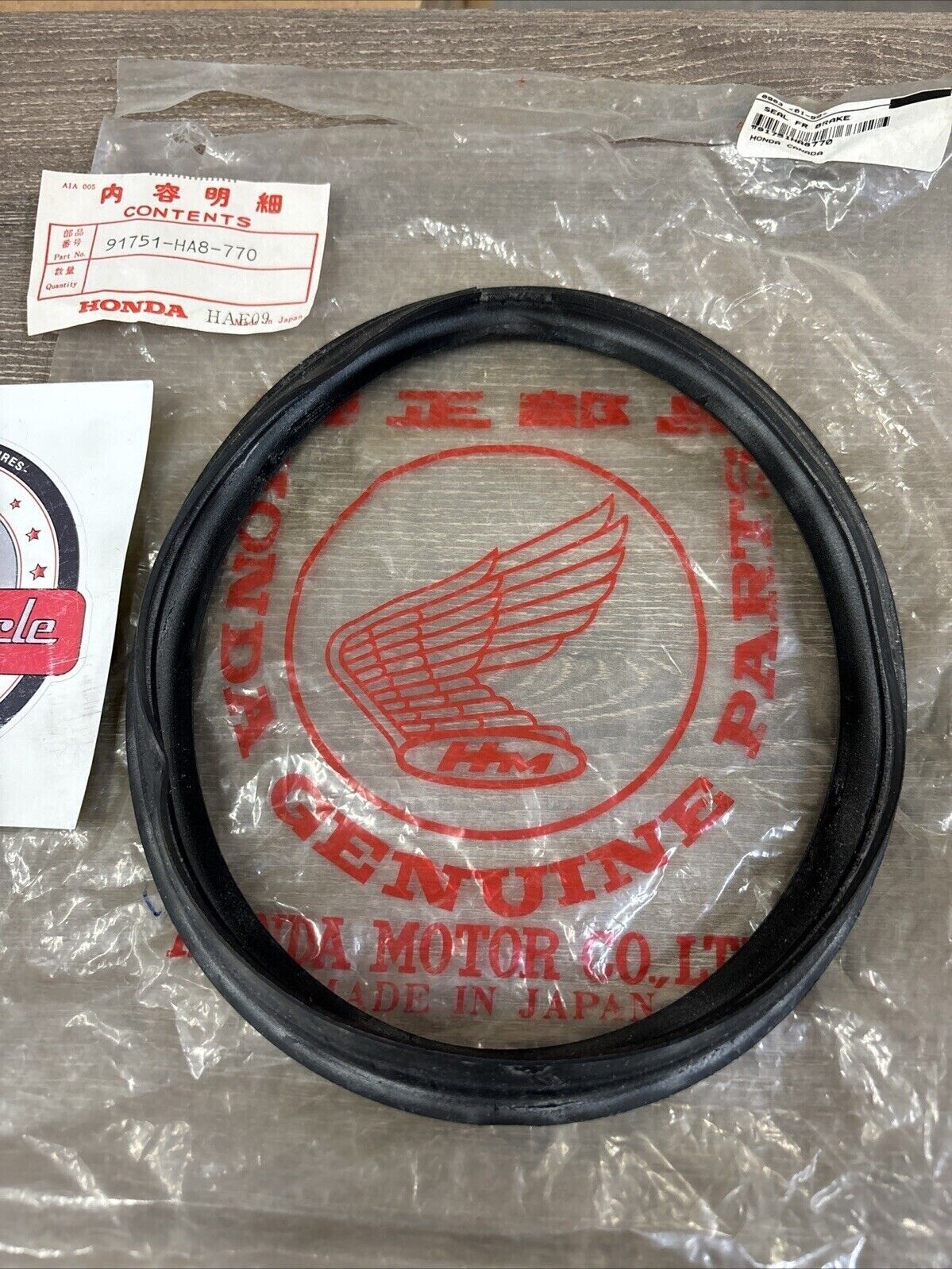 NOS Honda 1987 TRX250 FRONT BRAKE SEAL 91751-HA8-770 H119