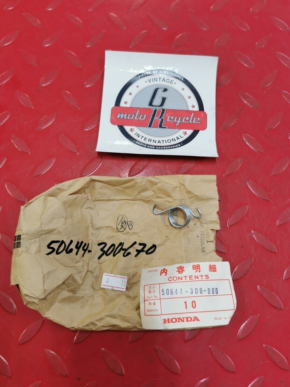 NOS Honda GL1000 SPRING L. STEP RETURN STAND 50644-300-000 50644-300-670 H32
