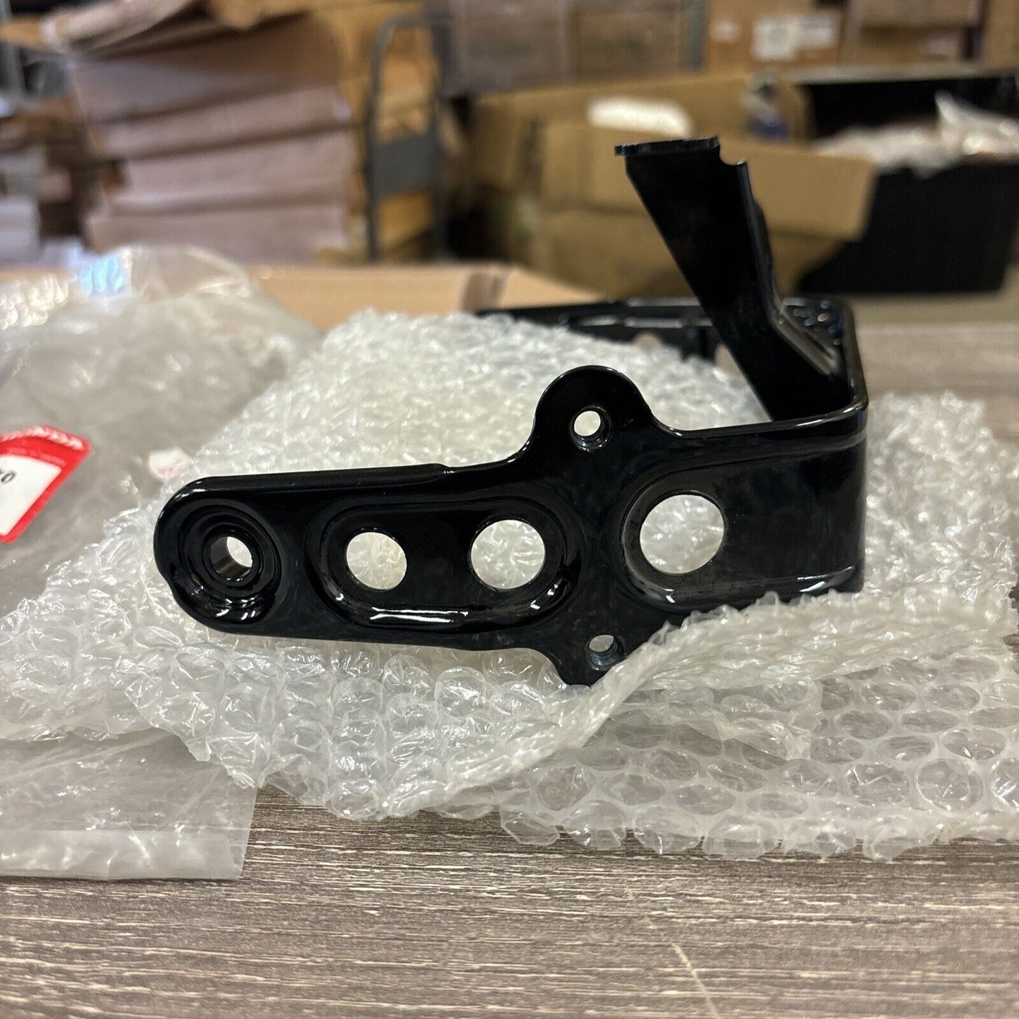 NOS Honda 1986 - 1987 TRX200SX HEADLIGHT BRACKET 61311-HB3-770 H114