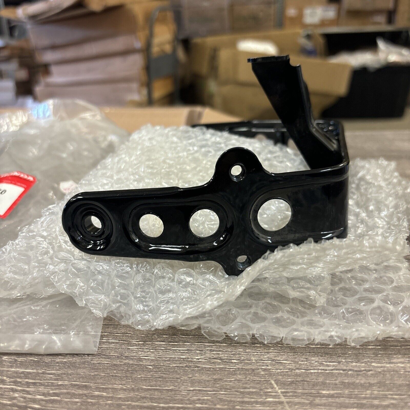NOS Honda 1986 - 1987 TRX200SX HEADLIGHT BRACKET 61311-HB3-770 H114
