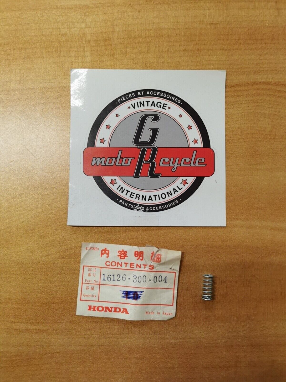 NOS Honda STOP SPRING 16126-300-004 H26
