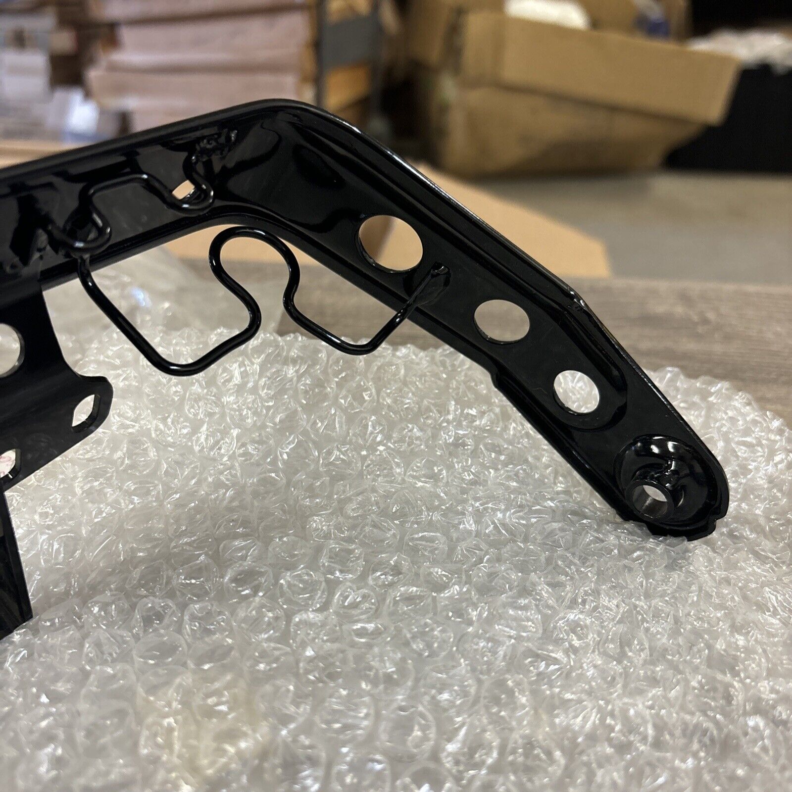 NOS Honda 1986 - 1987 TRX200SX HEADLIGHT BRACKET 61311-HB3-770 H114