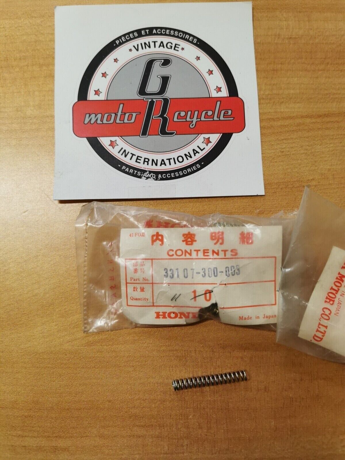 NOS Honda GL1100 CB750 CB500 GL1000 VT700 HEADLIGHT SPRING 33107-300-003 H26