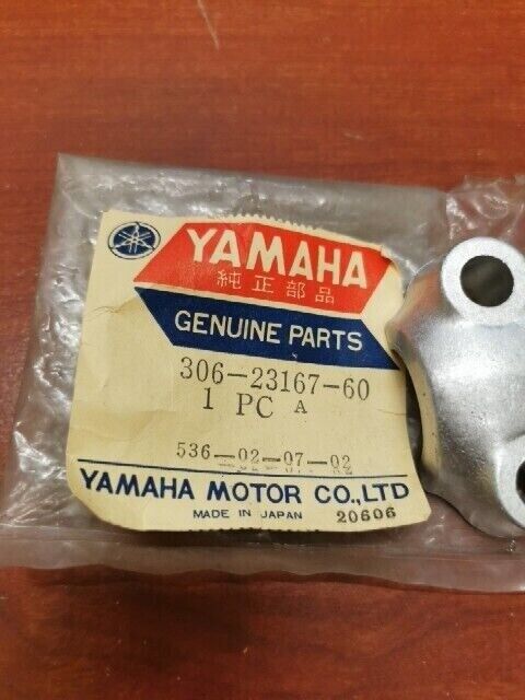 NOS Yamaha RD250 RD350 RD400 TX500 XS2 XS500 AXLE HOLDER 306-23167-60-00 Y129