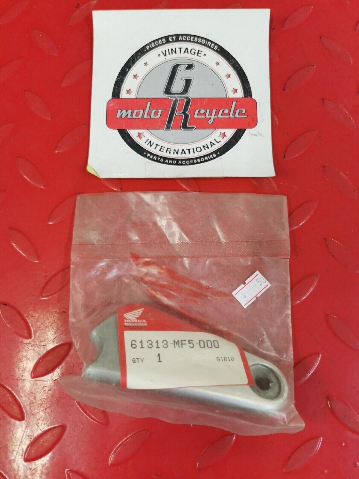 NOS HONDA  VT500C  1983 1984 STAY L  HEADLIGHT  61313-MF5-000 H39