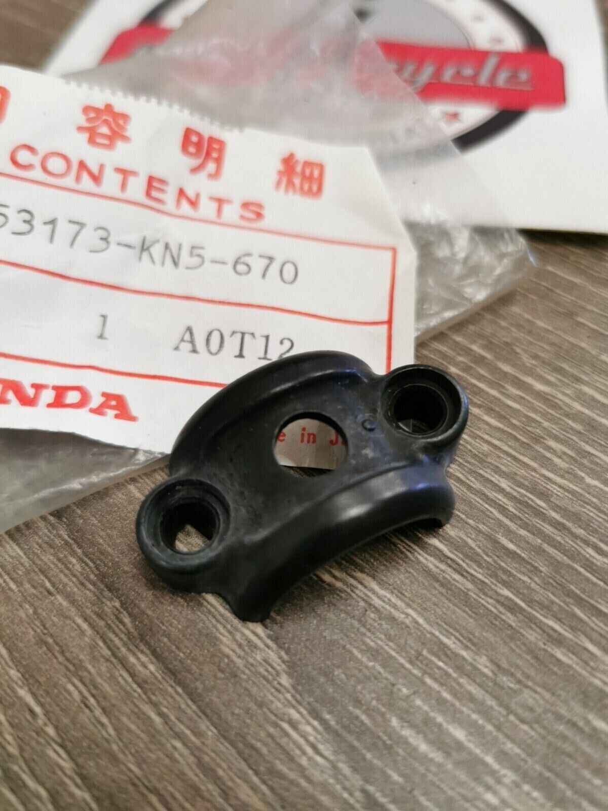 NOS HONDA HOLDER LEVER BRACKET 53173-KN5-670 H50