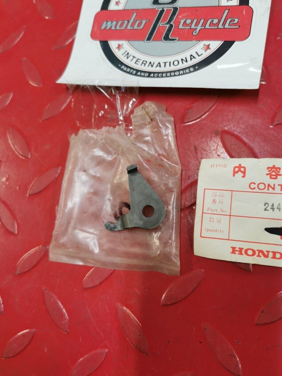 NOS Honda 1976 CB750K PLATE, GEARSHIFT FORK SHAFT STOPPER 24436-300-010 H32