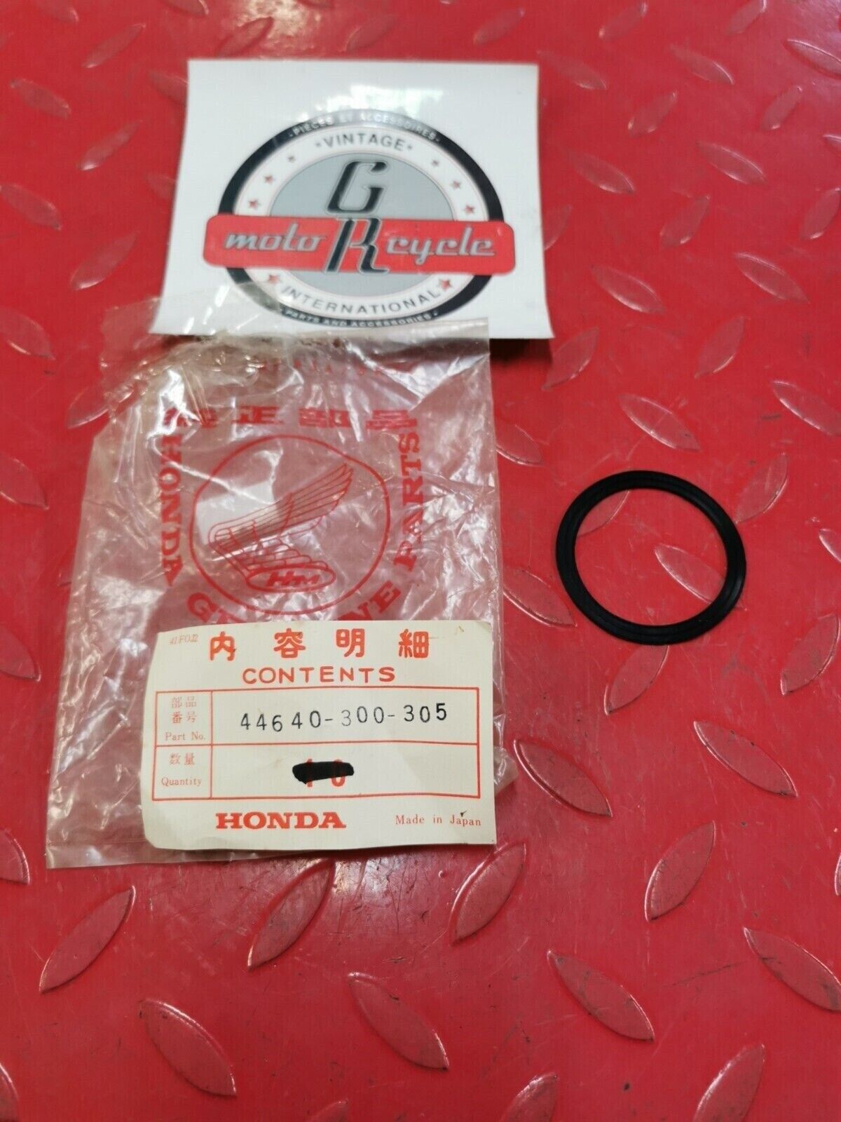 NOS Honda PACKING RETAINER 44640-300-305 H32