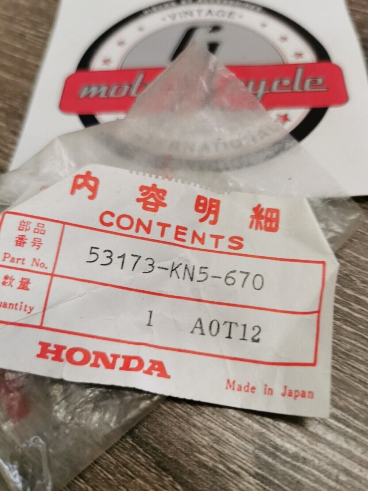 NOS HONDA HOLDER LEVER BRACKET 53173-KN5-670 H50