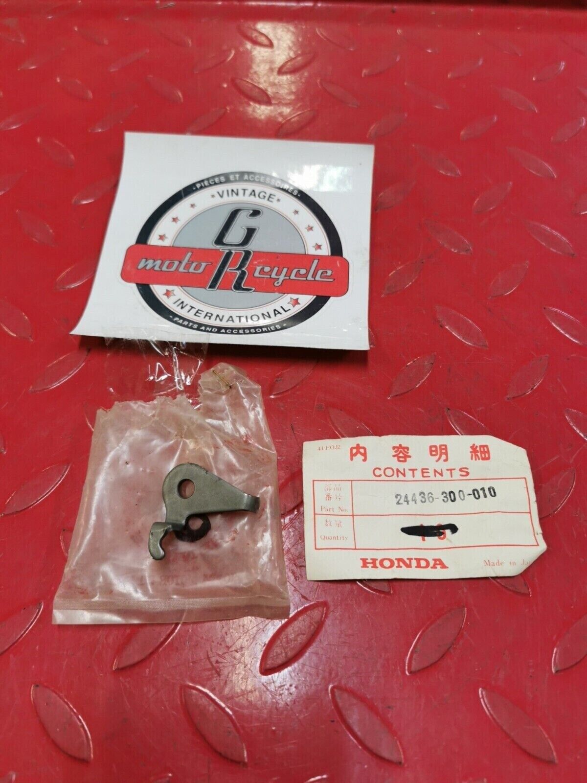 NOS Honda 1976 CB750K PLATE, GEARSHIFT FORK SHAFT STOPPER 24436-300-010 H32