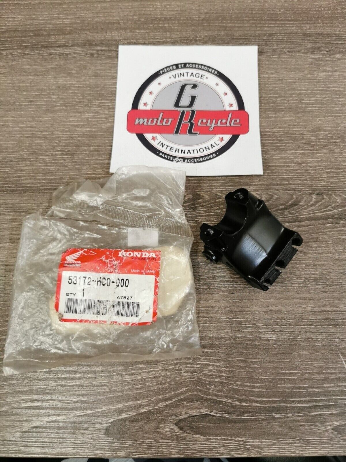 NOS HONDA TRX250X 1988 - 1992  BRACKET  L  HANDLE BAR 53172-HC0-000 H44