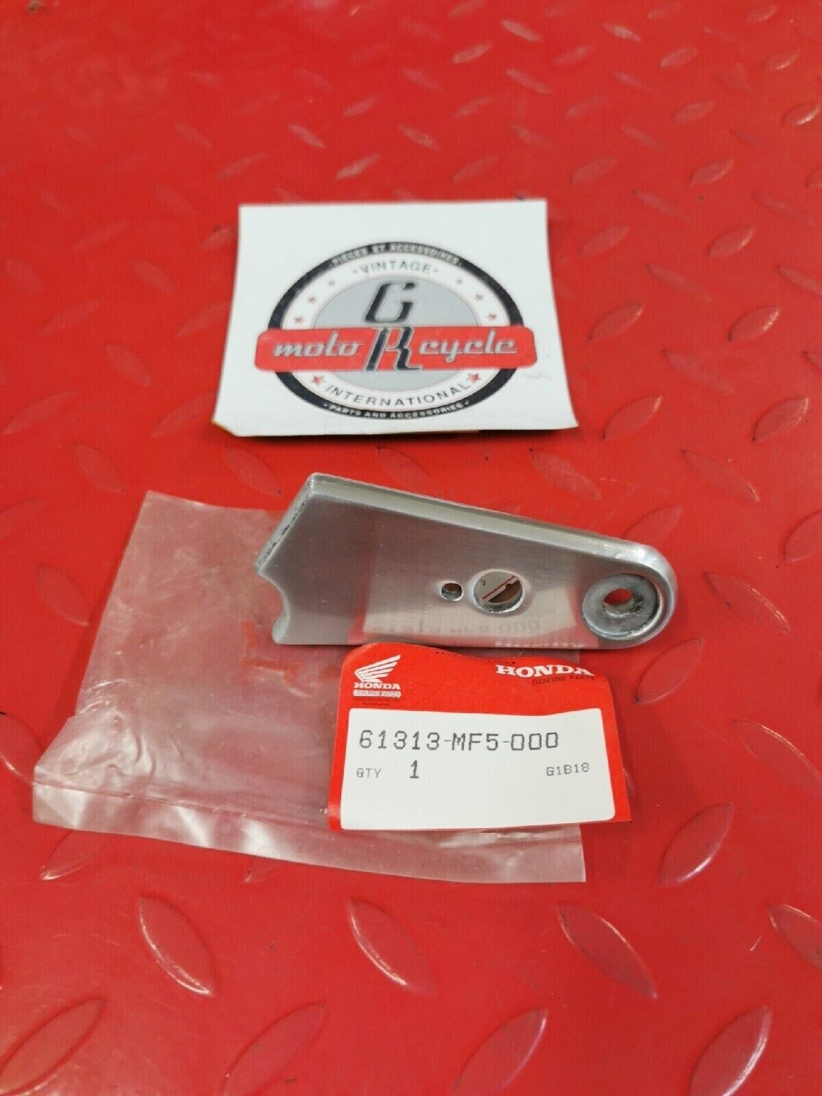 NOS HONDA  VT500C  1983 1984 STAY L  HEADLIGHT  61313-MF5-000 H39