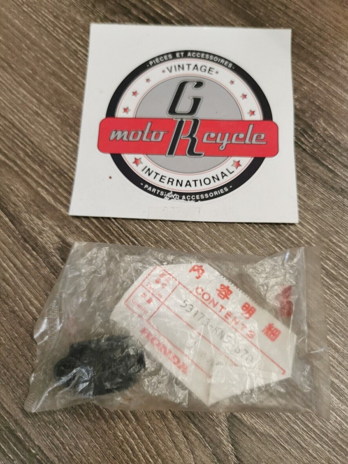 NOS HONDA HOLDER LEVER BRACKET 53173-KN5-670 H50