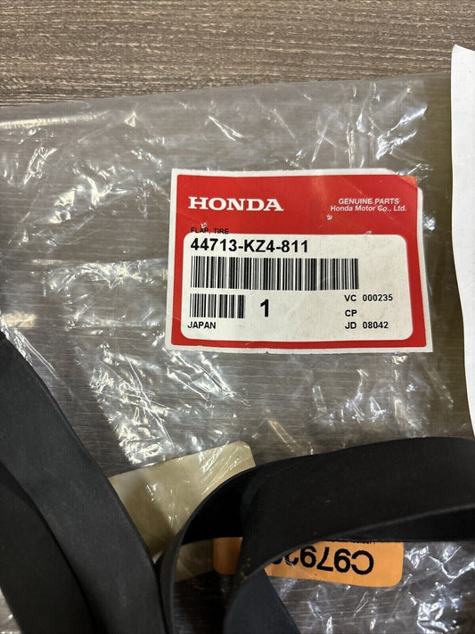 NOS Honda CR125R CR250R CRF250R CRF450R TIRE FLAP (DUNLOP) 44713-KZ4-811 H122