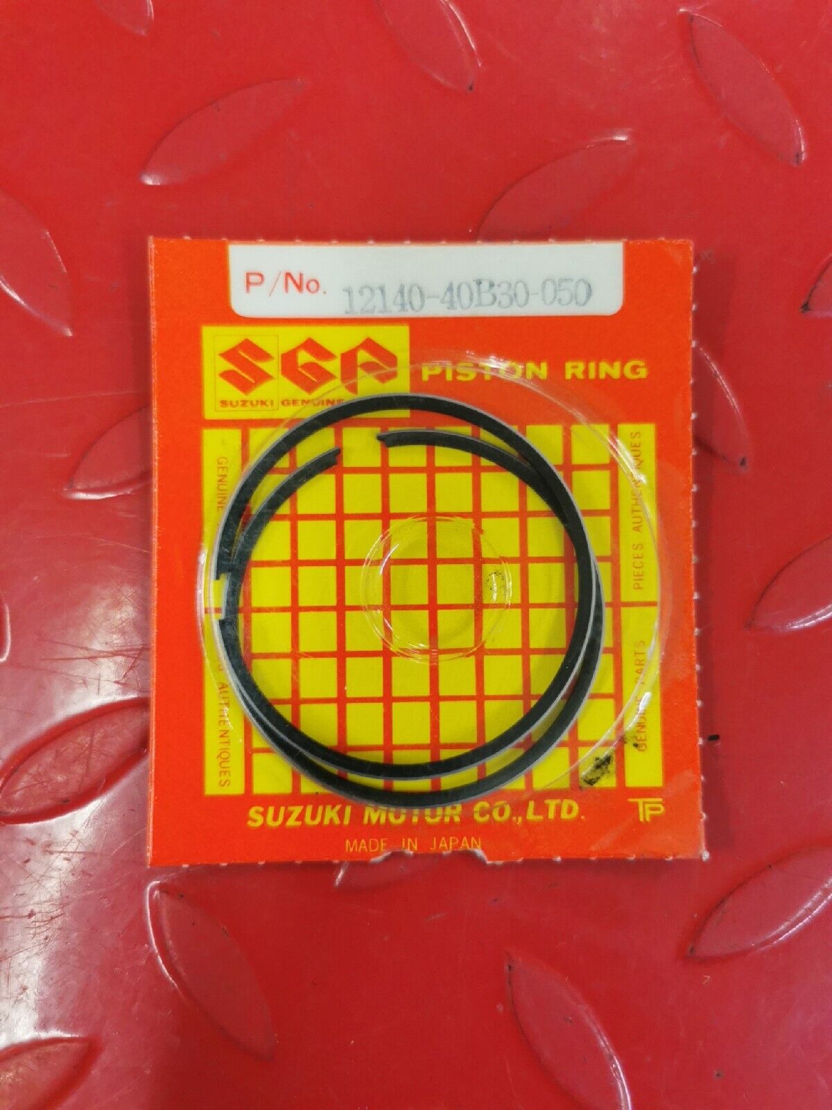 NOS SUZUKI LT80 2002 2003 2004 2005 2006 RING SET OS 0.5 12140-40B30-050 S11