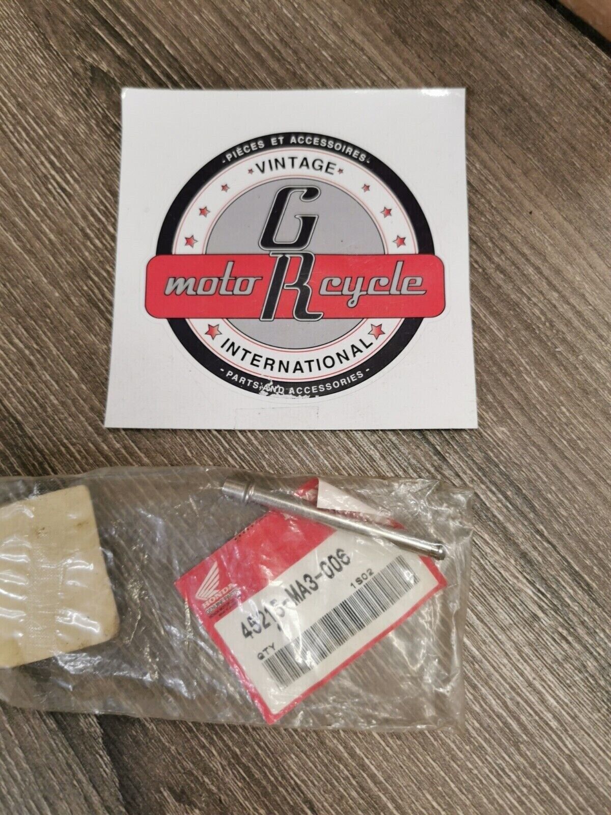 NOS HONDA HANGER PIN 45215-MA3-006  H55