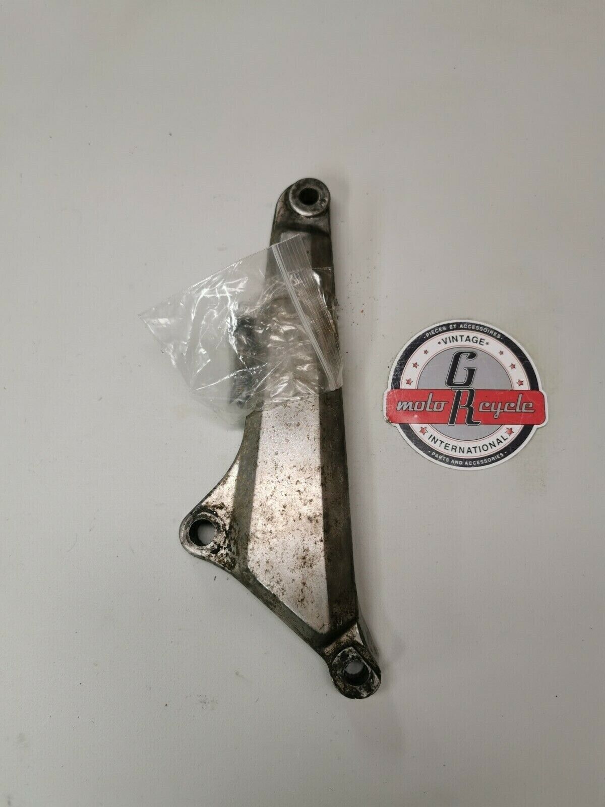 Honda CB750F 1978 left muffler holder rear footpeg foot peg bracket 1977