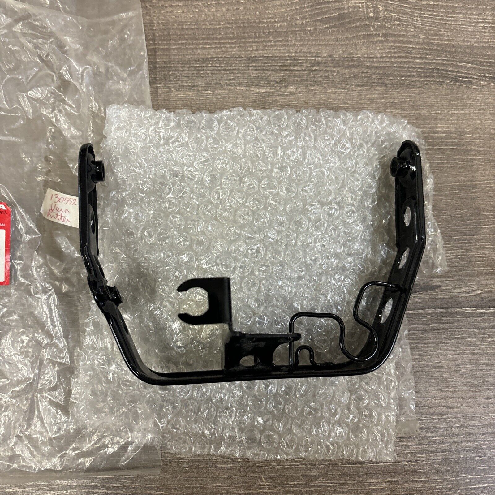NOS Honda 1986 - 1987 TRX200SX HEADLIGHT BRACKET 61311-HB3-770 H114